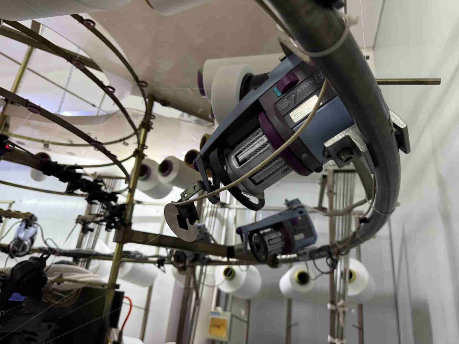 Precision yarn feeder tension sensors on Santoni circular knitting machine