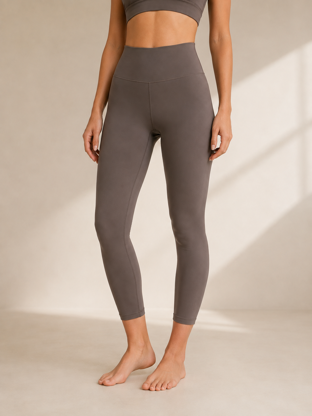 Custom high-waisted squat-proof yoga leggings on clean studio mannequin