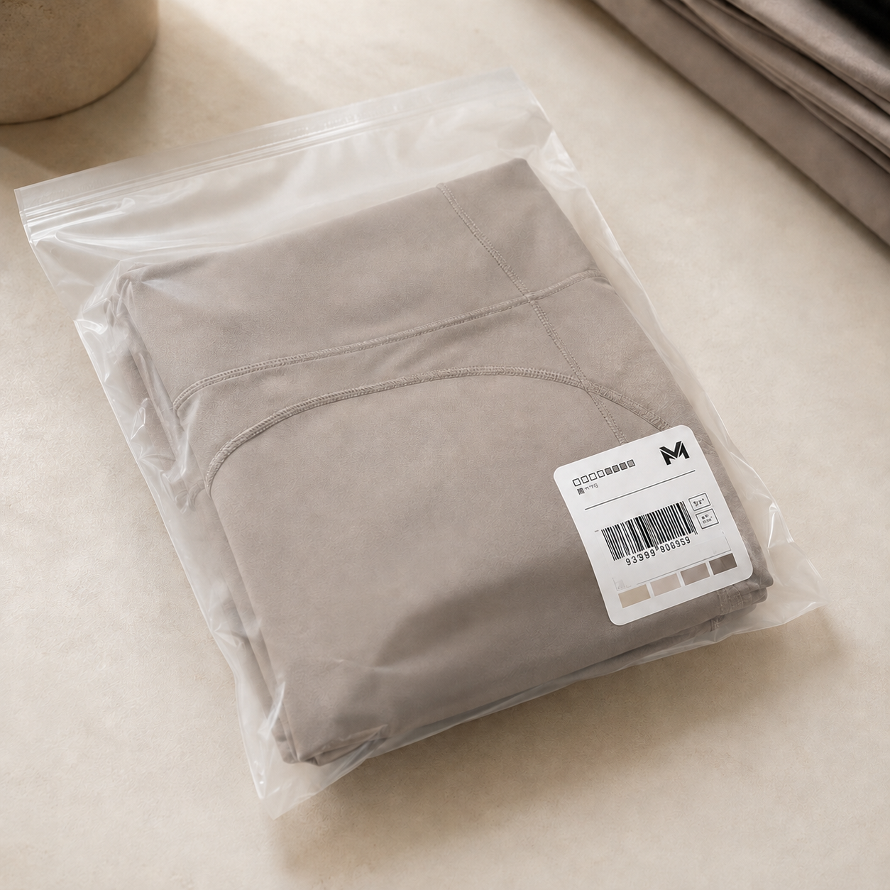 Sealed golden sample with MOVEVOX approved pre-production tag, fabric swatches, and First Article measurement inspection logs