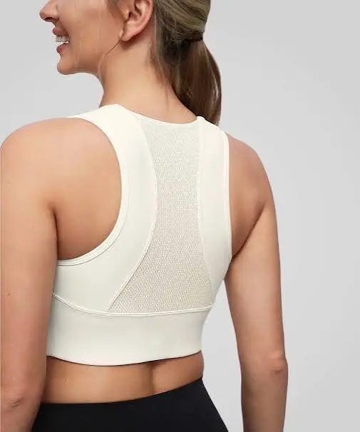 Seamless fitted athletic tank top with engineered ventilation mesh panels