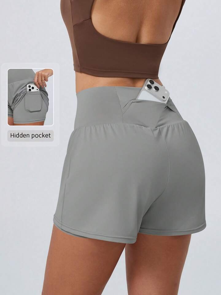 Concealed center back waistband zipper pocket for running keys