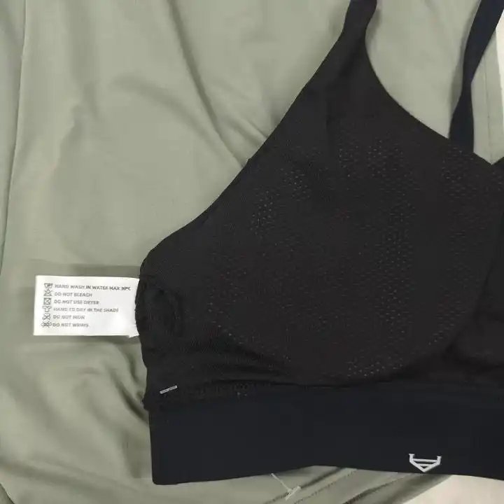 High-definition woven label on activewear side seam with soft edge fold