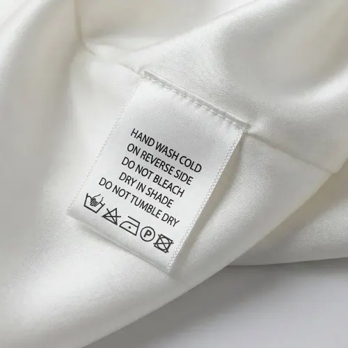 Legally compliant care label with multi-language fiber composition and care symbols