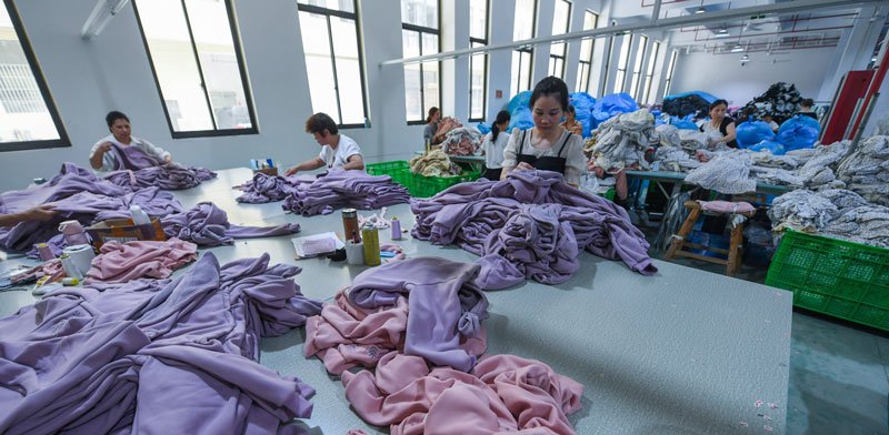 MOVEVOX quality inspection activity measuring and reviewing activewear garments