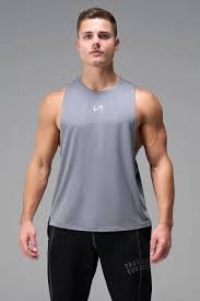 Strength training gym apparel display featuring reinforced drop-arm tanks and shorts