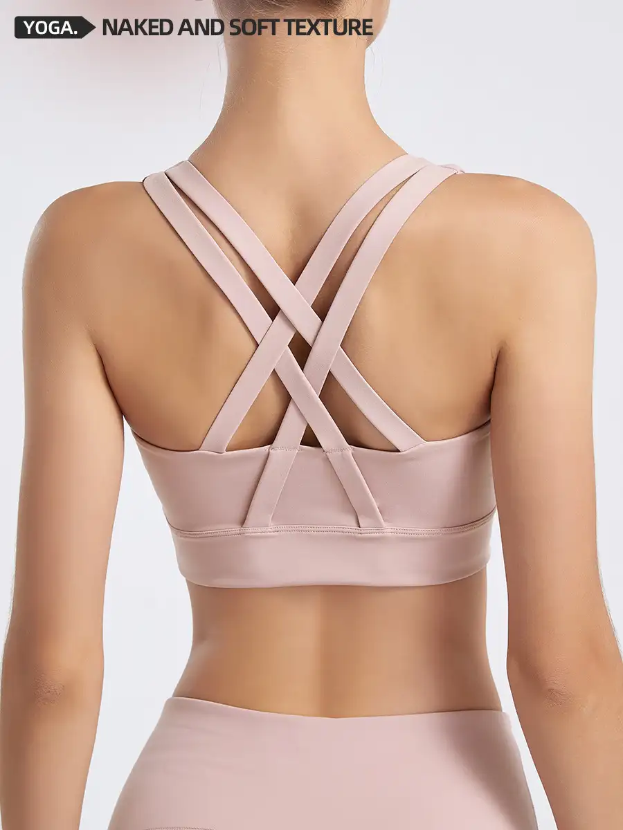 Wide shoulder strap tank showing neckline and support-layer attachment