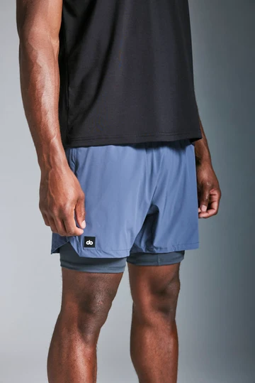 Engineered men's athletic training set featuring 2-in-1 shorts and fitted raglan tee