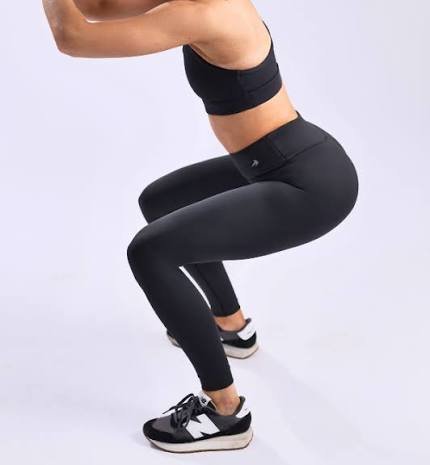 High-waist fitted Pilates leggings showing waist rise and hip construction detail