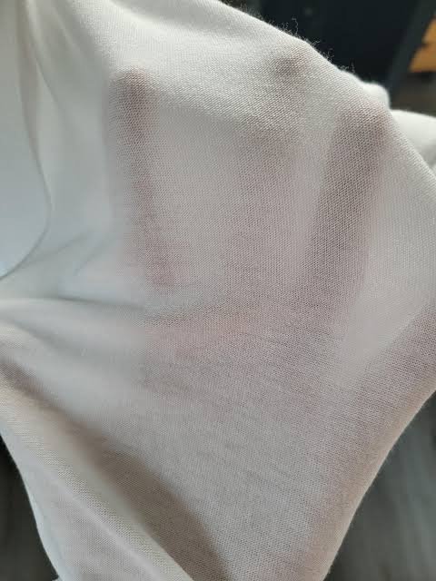 Activewear fabric showing transparent sheerness failure under tension