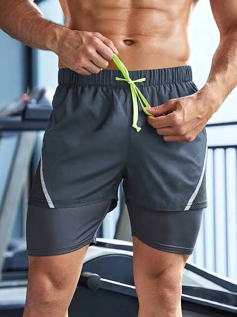 Reinforced dual layer elastic waistband tunnel with metal eyelets on gym shorts