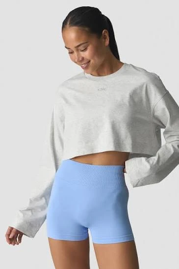 Relaxed cropped athleisure top showing daily-wear silhouette and hem proportions