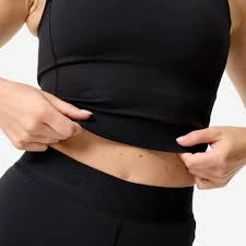 Close-up of the finished lower hem edge on a cropped training top
