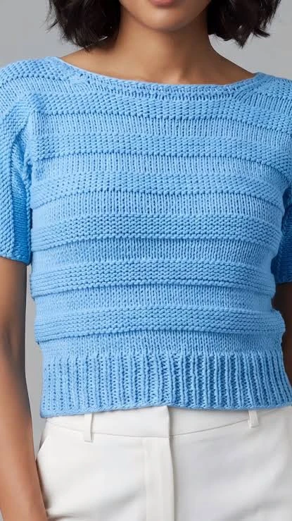 Front and back views of a ribbed seamless cropped activewear top for identifying knitting zones