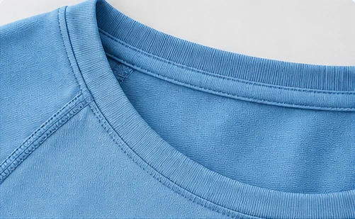Close-up of neckline binding and edge stitching on a yoga tank