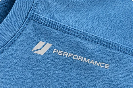 Close-up of shoulder seam joining and stitch construction on a gym training T-shirt