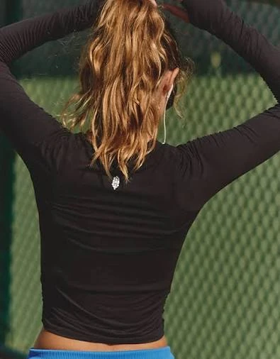 Long sleeve activewear fit review showing forward reach and upper back movement