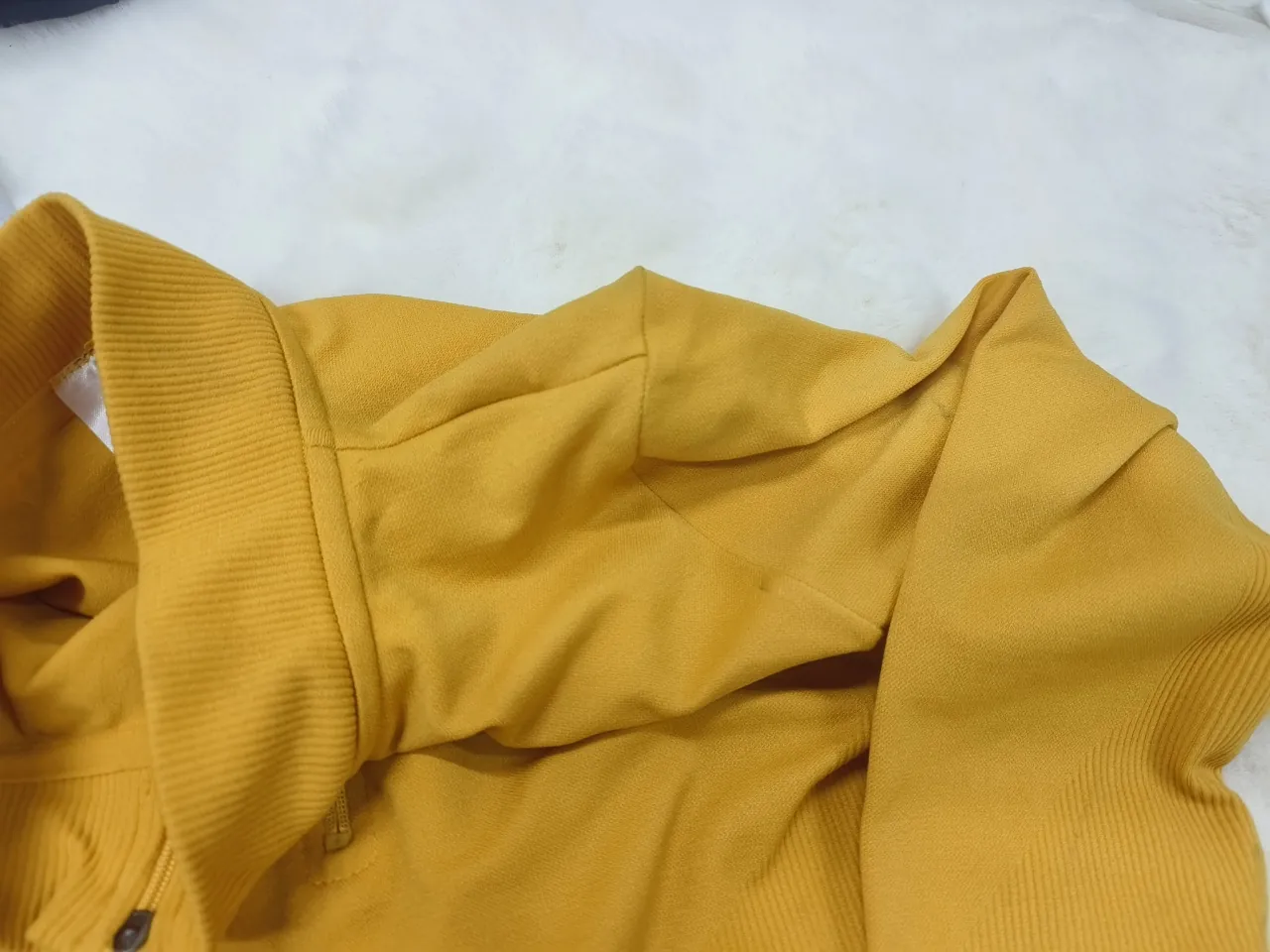 Close-up of the shoulder joining construction on a seamless long-sleeve top