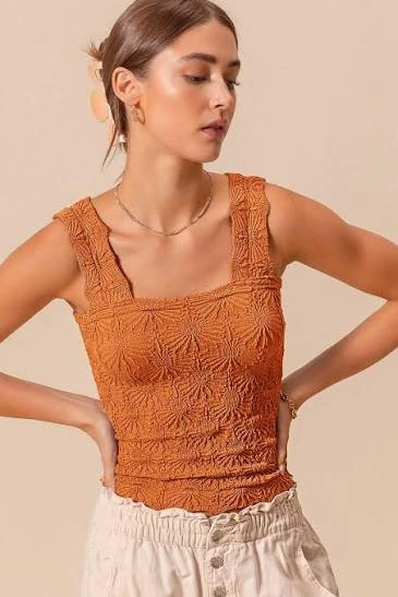 Textured seamless tank showing a knitted jacquard-style pattern and surface definition