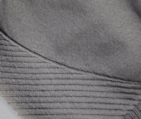 Side-body area of a seamless tank showing a transition between two knitted structures