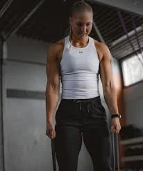 Muscle training tank top showing shoulder coverage and open armhole shape