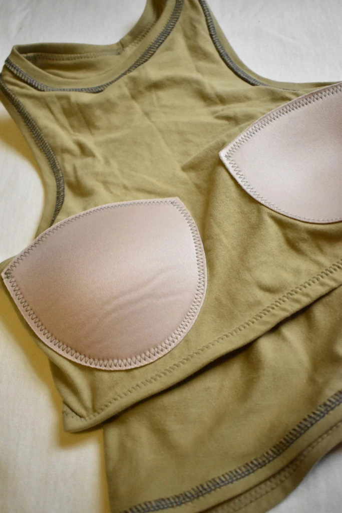 Molded cup components and technical fit inside a yoga tank inner support construction