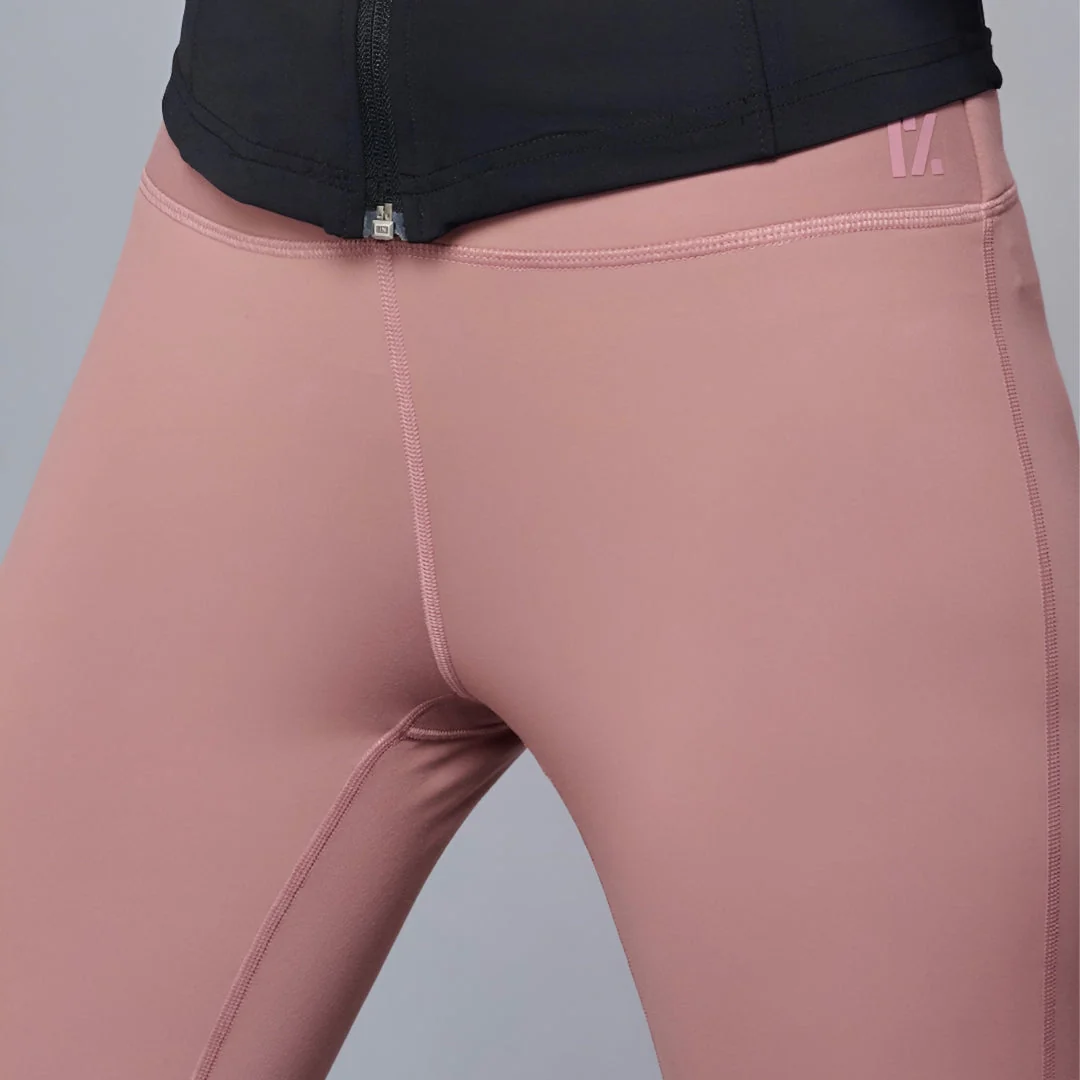 Close view of crotch seam junction on training leggings